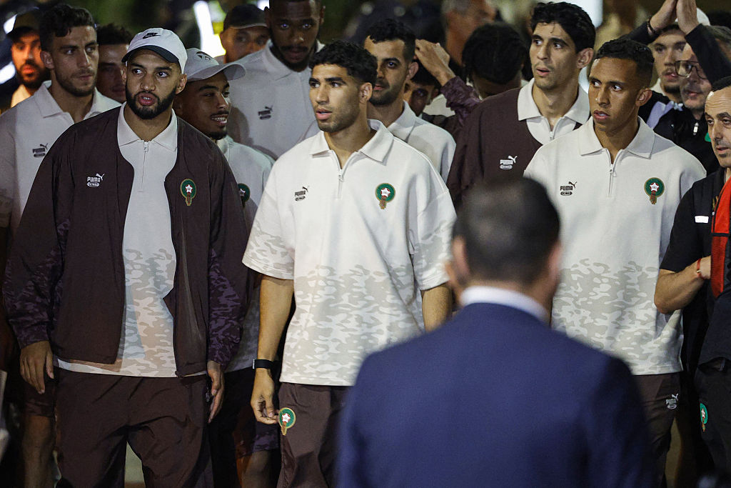 (L-R) Morocco's Ismael Saibari, Achraf Hakimi, and Soufiane Rahimi, along with members of the Morocco national football team, are seen upon their arrival at the Rabat–Salé Airport in Salé on July 12, 2026, after their return from Boston, United States, following their participation in the 2026 World Cup football tournament. (Photo by Abdel Majid BZIOUAT / AFP)